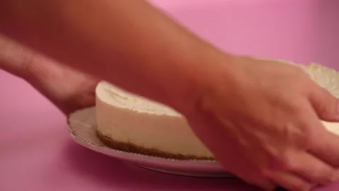 Preparing and serving a cheesecake with berry toppings Stock Footage 133807651