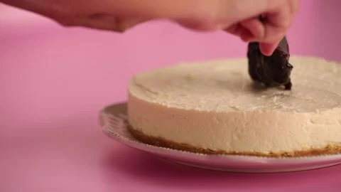 Preparing and serving a cheesecake with berry toppings Stock Footage 133807884