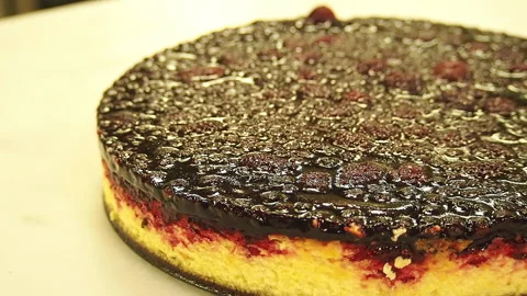 Preparing and serving a cheesecake with lemon raspberry toppings. Stock Footage 141699732