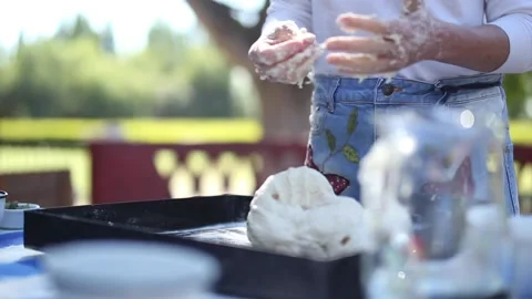 Preparing and serving focaccia bread  prosciutto, dried tomatoes, black olive Stock Footage 133748678