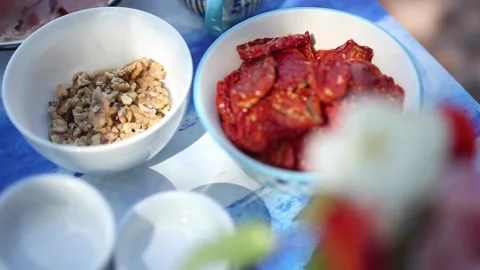 	preparing and serving focaccia bread prosciutto, dried tomatoes, black olive Video stock 133748808