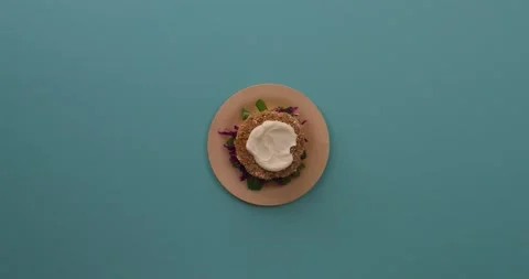 Preparing and serving quinoa burger Stock Footage 132145915