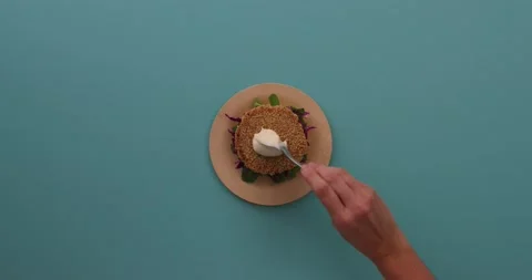 Preparing and serving quinoa burger Stock Footage 132145920