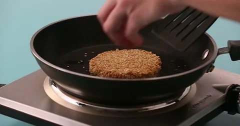 Preparing and serving quinoa burger Stock Footage 132146120