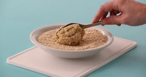 Preparing and serving quinoa burger Stock Footage 132146138