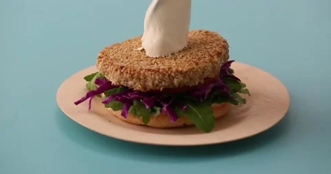 Preparing and serving quinoa burger Stock Footage 132146157