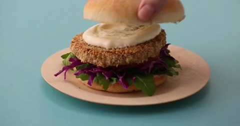 Preparing and serving quinoa burger Stock Footage 132146163