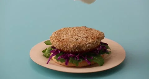 Preparing and serving quinoa burger Stock-Footage 132146190