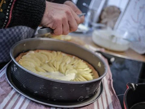 Preparing an apple cake during lockdown Stock Photos