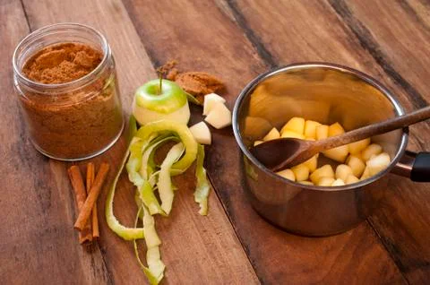 Preparing an apple sauce Stock Photos