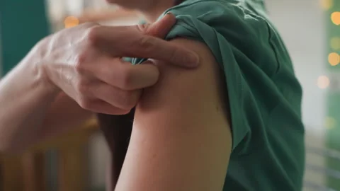 Preparing arm for injection routine. Closeup of adult sanitizing arm for shot Stock Footage 342282218