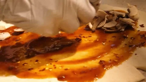 Preparing Authentic Italian Mushroom Pizza on Raw Dough with Tomato Sauce Video stock 337678696