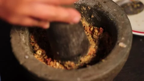 Preparing Authentic Thai Chili Paste in Traditional Stone Mortar Close Up Stock Footage 340249013