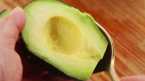 Preparing an avocado Stock Footage 93789312