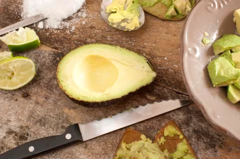 Preparing an avocado salad Stock Photos
