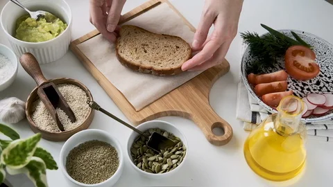 Preparing Avocado Toast In The Kitchen. Stock Footage 128680636