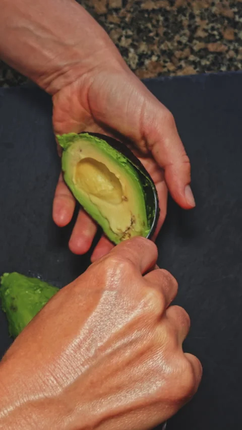 Preparing Avocado on Toasted Multigrain Bread Stock Footage 277725721