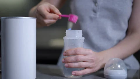 Preparing Baby Formula with Care, Precision, and Thoughtfulness for Your Infants Stock Footage 301436463