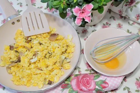 Preparing bacon and eggs Stock Photos