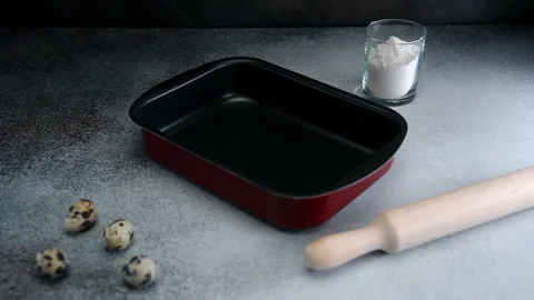 Preparing to Bake a Cake: Gathering Ingredients and Tools in a Home Kitchen Stock Footage 273700665