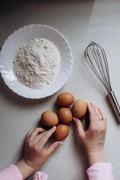 Preparing to Bake with Flour and Eggs on Kitchen Counter Stock Photos
