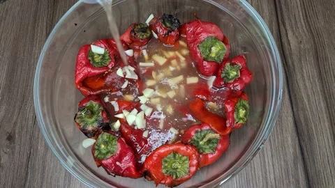 Preparing baked red pepper salad with garlic and tomatoes Stock Footage 166794204