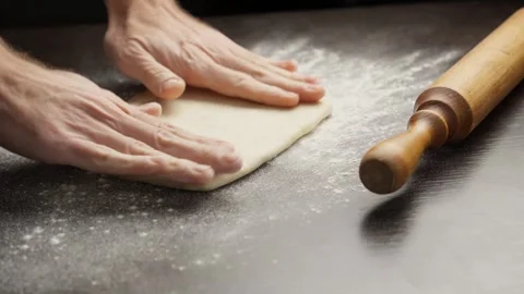 Preparing for baking. Baker prepares dough for croissants. Working moment Stock Footage 296875572