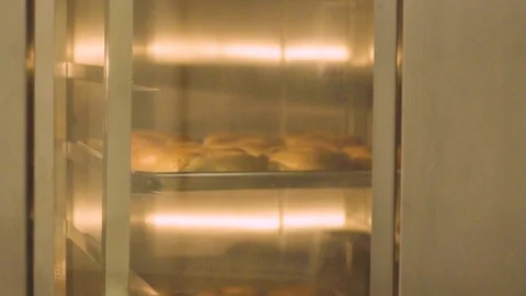 Preparing &amp; Baking Delicious New York Style Bagels In A Cafe Bakery Deli Stock Footage 123674025