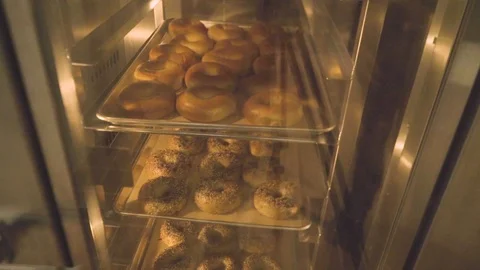 Preparing &amp; Baking Delicious New York Style Bagels In A Cafe Bakery Deli Stock Footage 123674057