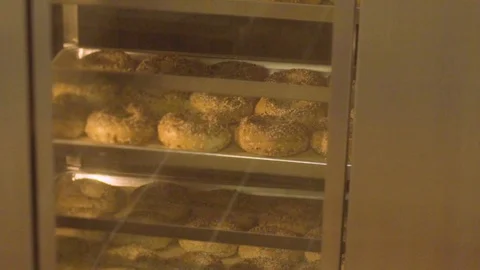 Preparing &amp; Baking Delicious New York Style Bagels In A Cafe Bakery Deli Stock Footage 123674076