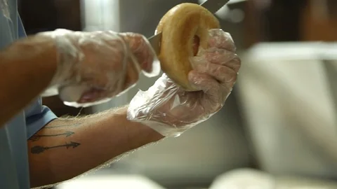Preparing &amp; Baking Delicious New York Style Bagels In A Cafe Bakery Deli Stock Footage 123674171