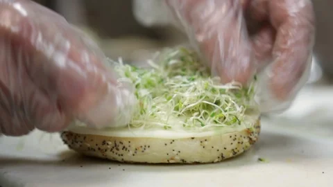 Preparing &amp; Baking Delicious New York Style Bagels In A Cafe Bakery Deli Stock Footage 123674406