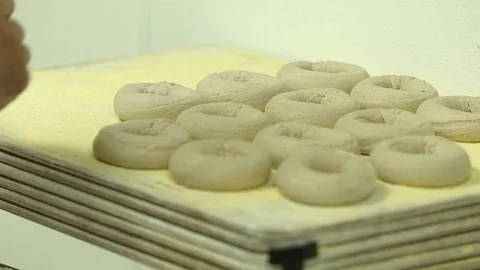 Preparing &amp; Baking Delicious New York Style Bagels In A Cafe Bakery Deli Stock Footage 123674483