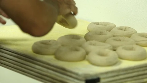 Preparing &amp; Baking Delicious New York Style Bagels In A Cafe Bakery Deli Stock Footage 123674531
