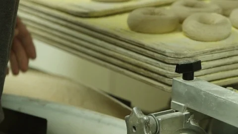 Preparing &amp; Baking Delicious New York Style Bagels In A Cafe Bakery Deli Stock Footage 123674629