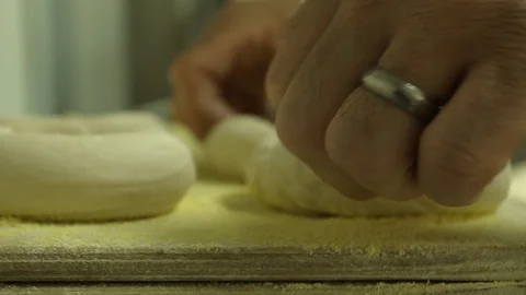 Preparing &amp; Baking Delicious New York Style Bagels In A Cafe Bakery Deli Stock Footage 123674807