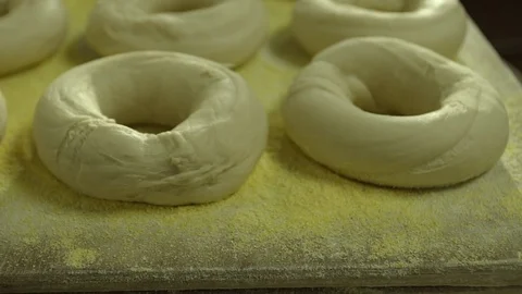 Preparing &amp; Baking Delicious New York Style Bagels In A Cafe Bakery Deli Stock Footage 123674909
