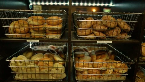 Preparing &amp; Baking Delicious New York Style Bagels In A Cafe Bakery Deli Stock Footage 123675115