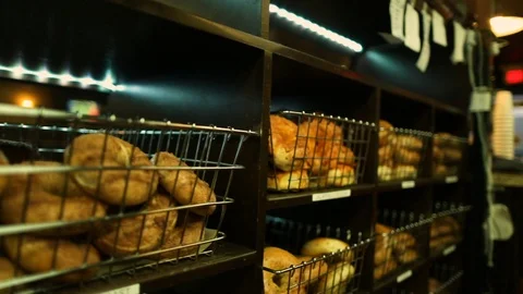 Preparing &amp; Baking Delicious New York Style Bagels In A Cafe Bakery Deli Stock Footage 123675269