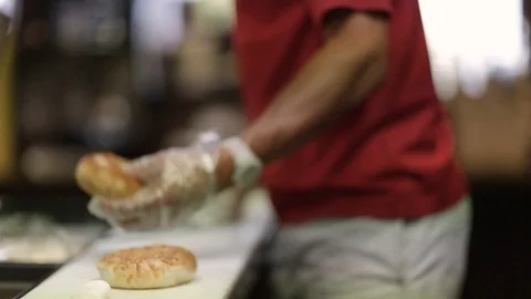 Preparing &amp; Baking Delicious New York Style Bagels In A Cafe Bakery Deli Stock Footage 123878210