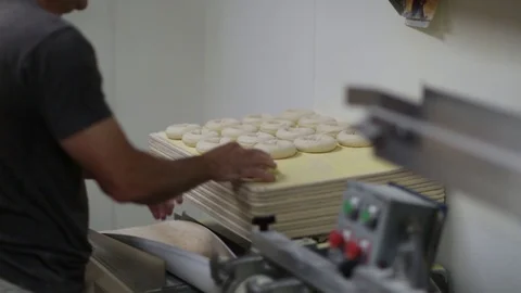 Preparing &amp; Baking Delicious New York Style Bagels In A Cafe Bakery Deli Stock Footage 123878267