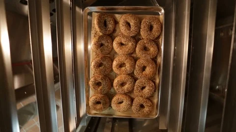 Preparing &amp; Baking Delicious New York Style Bagels In A Cafe Bakery Deli Stock Footage 123878336