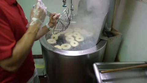 Preparing &amp; Baking Delicious New York Style Bagels In A Cafe Bakery Deli Stock Footage 123878350