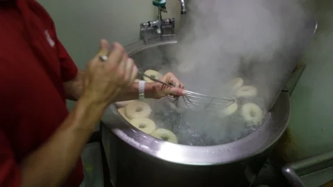 Preparing &amp; Baking Delicious New York Style Bagels In A Cafe Bakery Deli Stock Footage 123878371