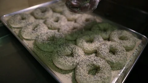 Preparing &amp; Baking Delicious New York Style Bagels In A Cafe Bakery Deli Stock Footage 123878407