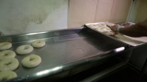Preparing &amp; Baking Delicious New York Style Bagels In A Cafe Bakery Deli Stock Footage 123878502