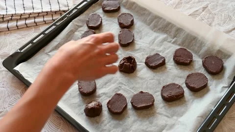 Preparing a baking tray with heart-shaped cookies. Stock Footage 219962944