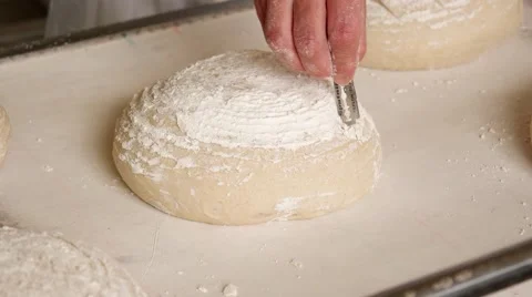 Preparing the Ball dough on the tray before being baked, closeup Stock Footage 64471065
