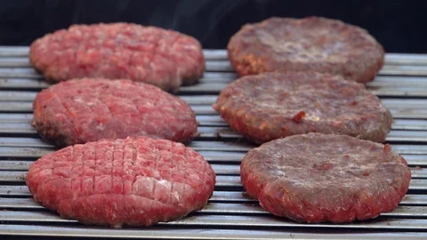 Preparing barbecue, chef turning roast burgers on grill. 4K 動画素材 116728396