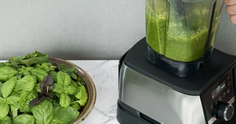 Preparing basil pesto with blender. Stock Footage 281423380